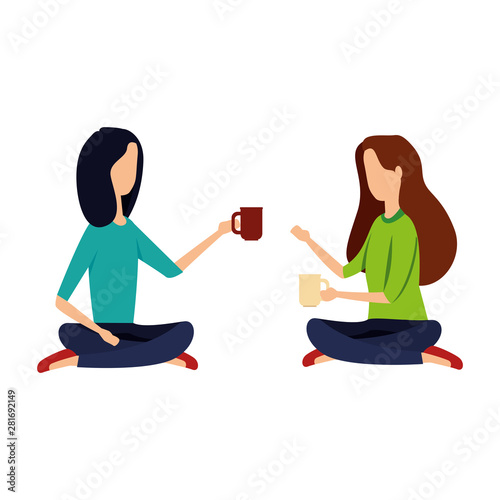 businesswomen drinking coffee seated in lotus position