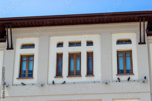Perspective shoot of old turkish municipality building facade with open yellow tones