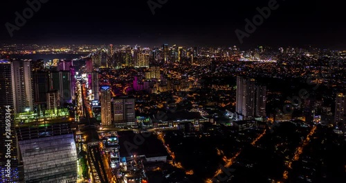 Aerial Hyper lapse of Metro Manila at night. during a thunderstorm photo