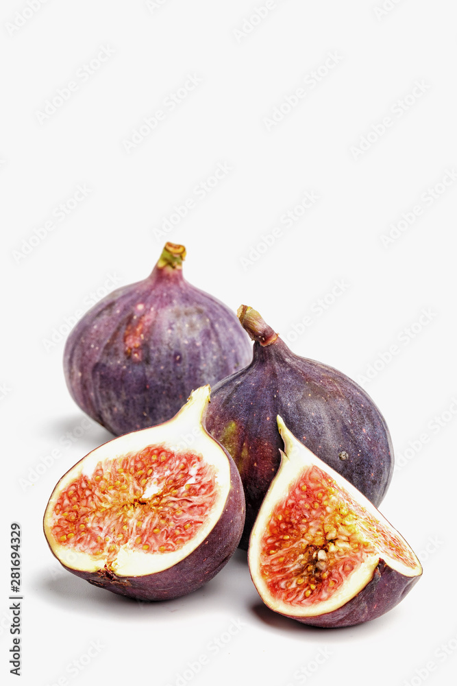 Ripe juicy figs on a white background. Ripe juicy figs on a white background.