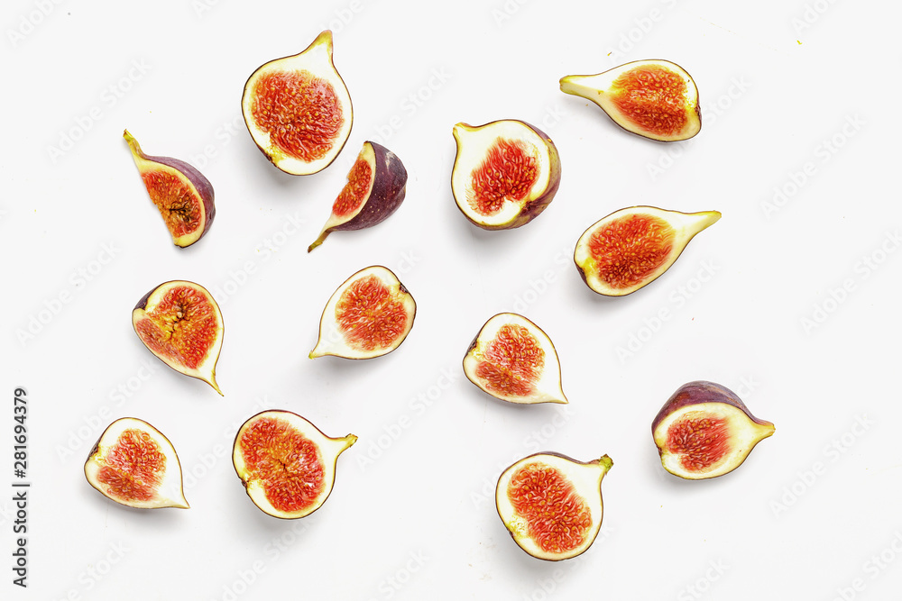 sliced ripe juicy figs on a white background. Top view. sliced ripe juicy figs on a white background. Top view.
