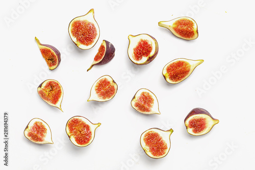 Fototapeta Naklejka Na Ścianę i Meble -  sliced ripe juicy figs on a white background. Top view.