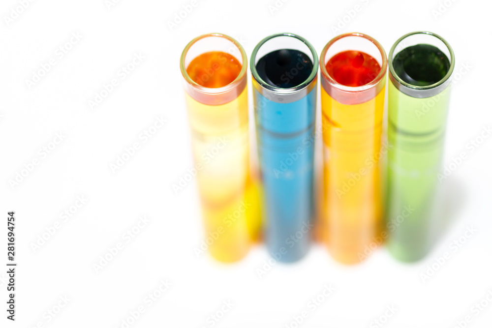 Test tubes filled with various water testing liquids on white background Test tubes filled with various water testing liquids on white background