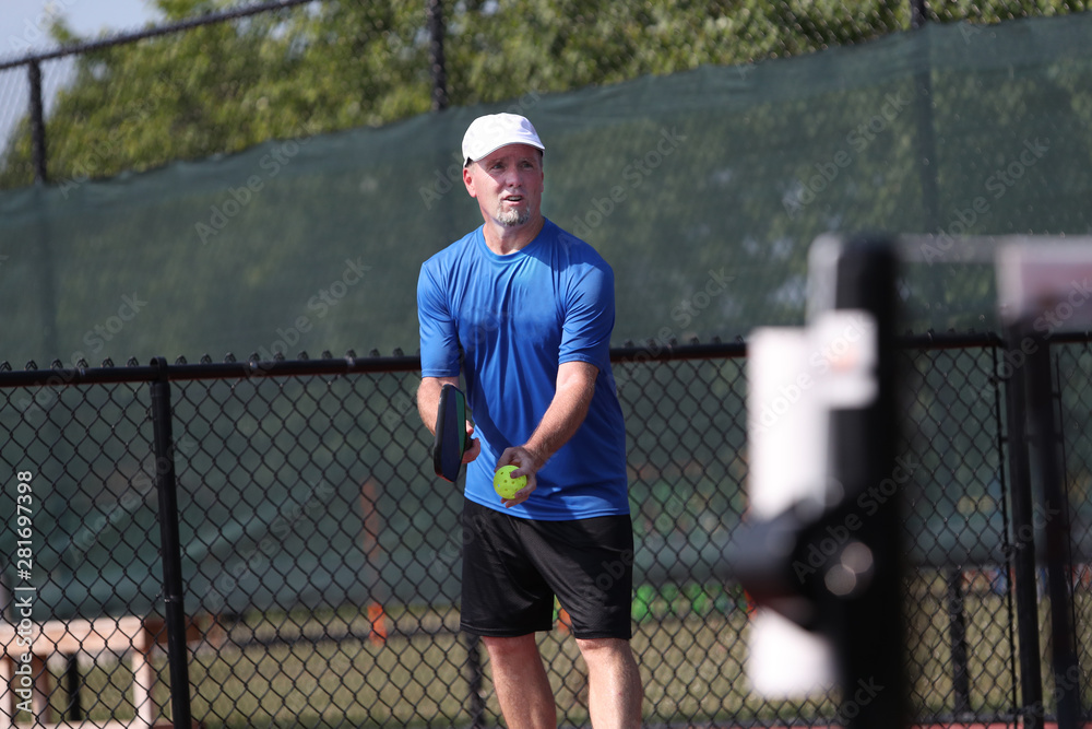 a senior competes in a pickleball tournament a senior competes in a pickleball tournament