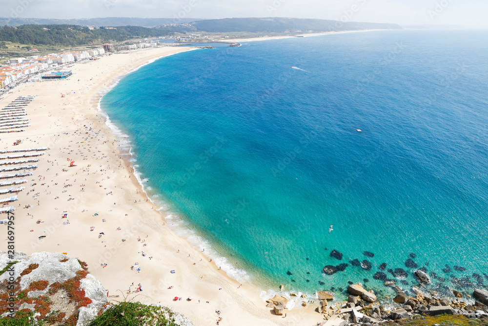 Obraz premium Nazare, Leiria, Portugal - July 01, 2019: View of Nazare Beach, from the viewpoint of Suberco, in the Leiria District, in Portugal.