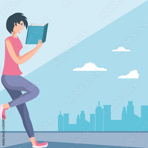 young woman reading book in cityscape