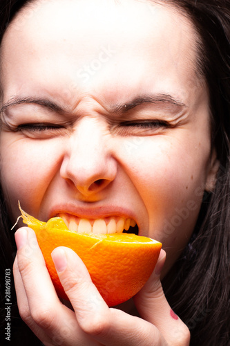 beautiful young woman with oranges
