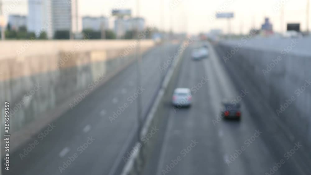 view of urban car traffic early in the morning, defocus makes beautiful bokeh from the included headlights, general plan view of urban car traffic early in the morning, defocus makes beautiful bokeh from the included headlights, general plan