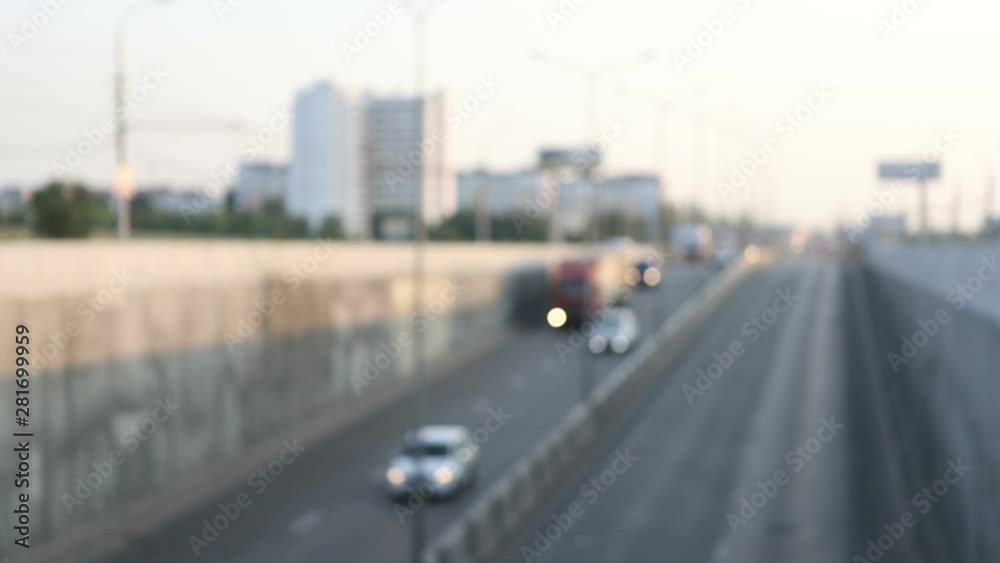 Abstract bokeh of car headlights in the morning city road traffic Abstract bokeh of car headlights in the morning city road traffic