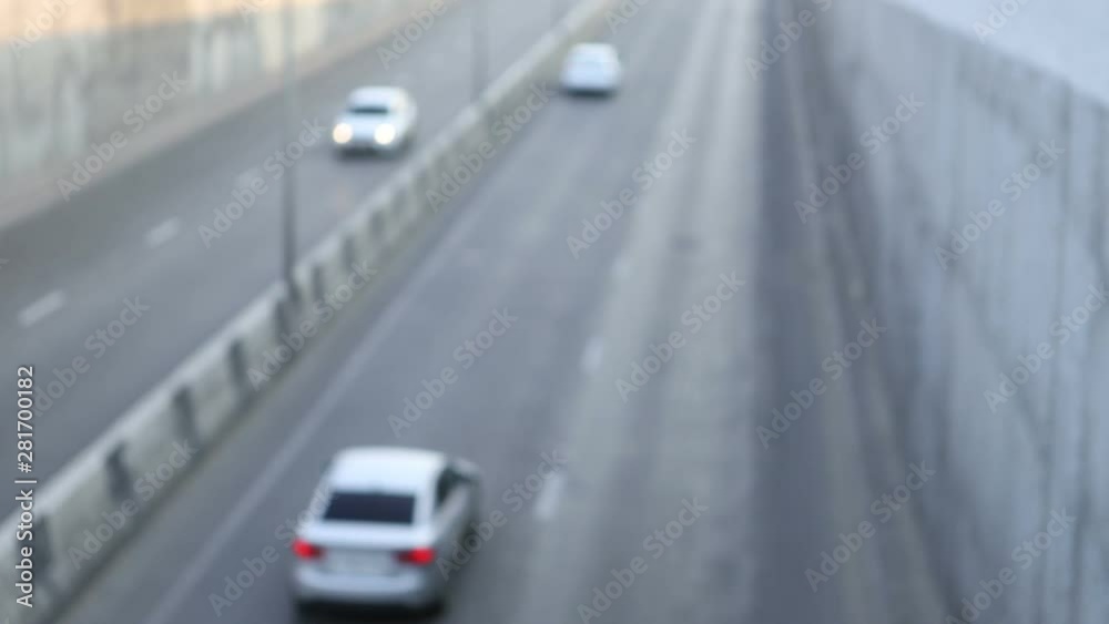 Abstract bokeh of car headlights in the morning city road traffic Abstract bokeh of car headlights in the morning city road traffic