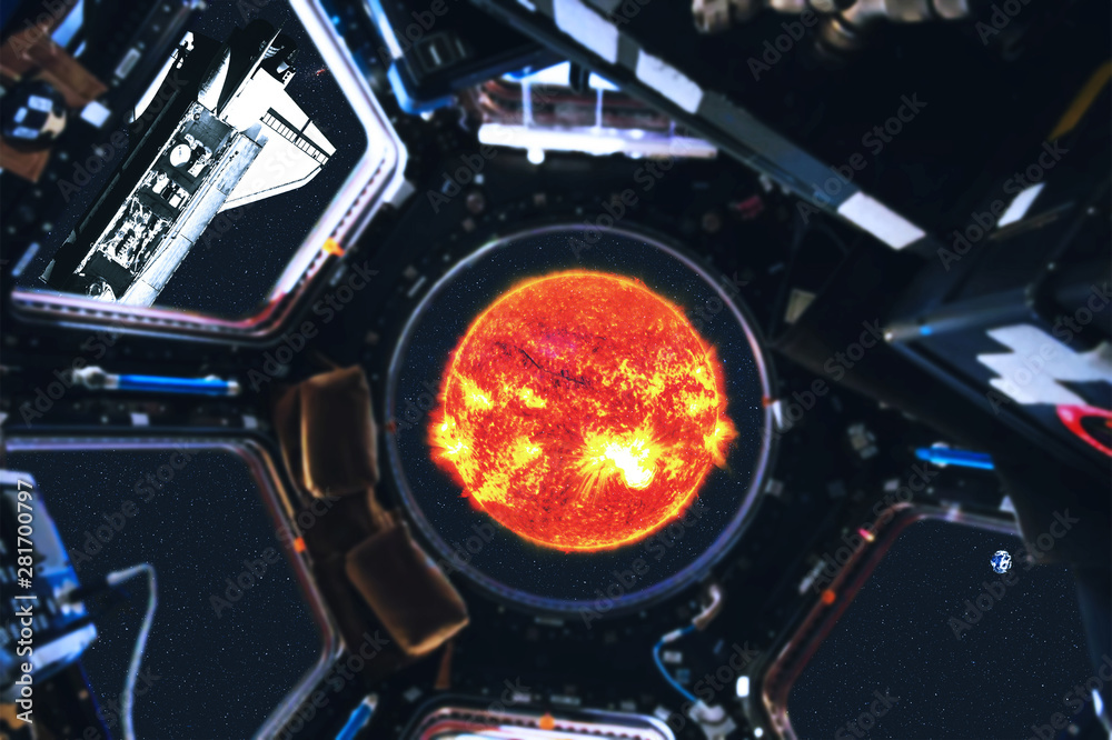 View of space shuttle and Sun of Solar system from space station. Outer space. Elements of this image furnished by NASA View of space shuttle and Sun of Solar system from space station. Outer space. Elements of this image furnished by NASA
