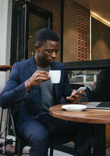 Business man working from a cafe