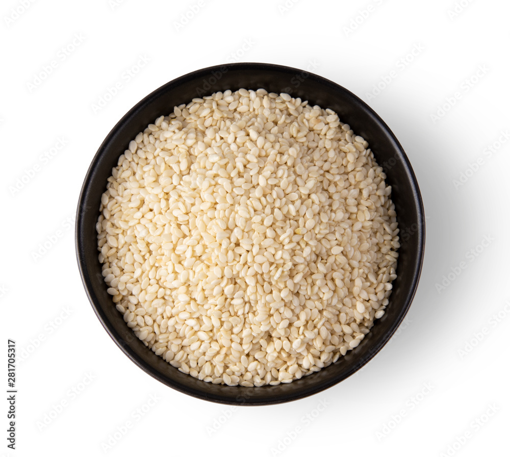 white sesame in a bowl isolated on white background. top view white sesame in a bowl isolated on white background. top view