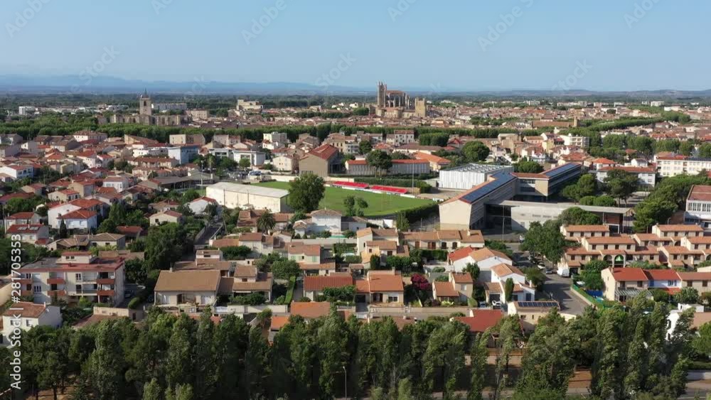 Narbonne Cathedral and football stadium aerial shot sunny day 