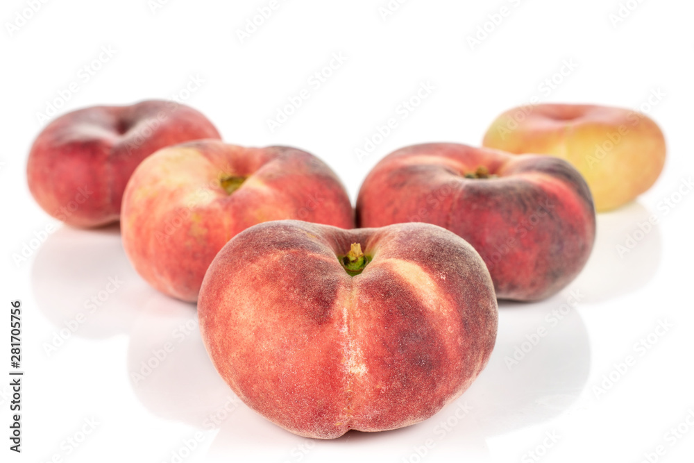Group of five whole fresh red peach prunus persica platycarpa arranged symmetrically isolated on white background Group of five whole fresh red peach prunus persica platycarpa arranged symmetrically isolated on white background