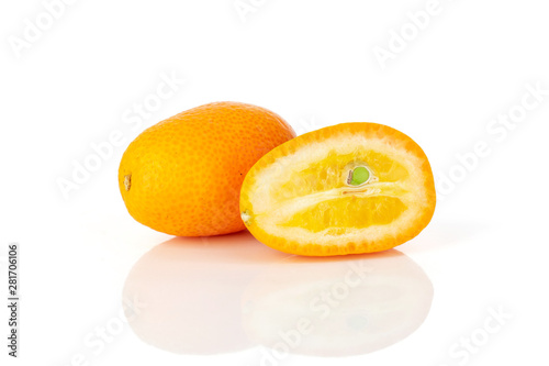 Group of one whole one half of fresh orange kumquat isolated on white background