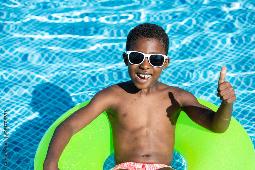 kids smiling and happy at the pool - obrazy, fototapety, plakaty 