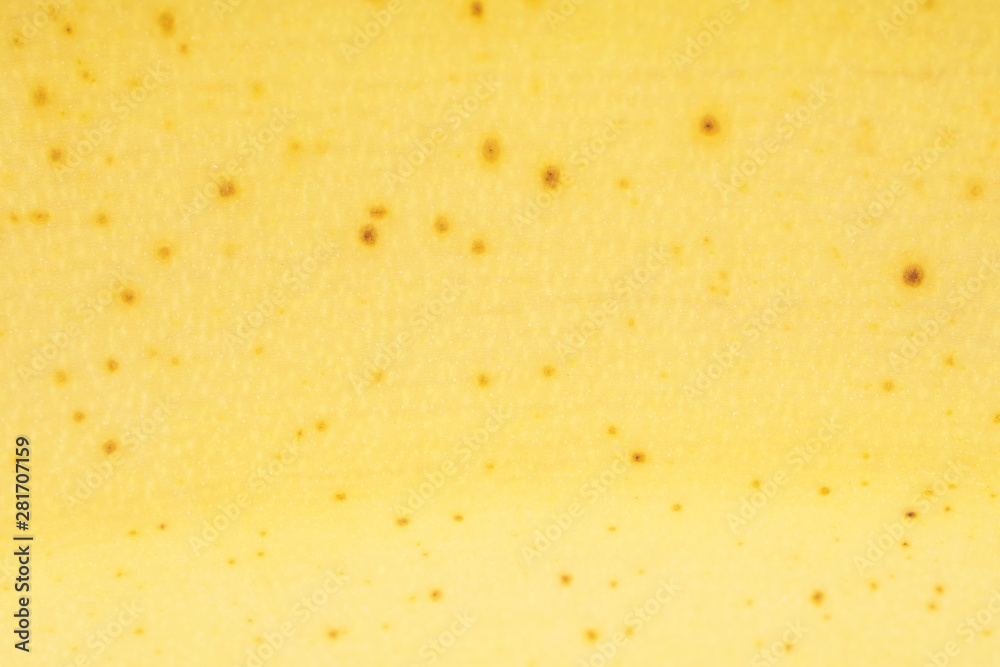 One whole ripe yellow banana skin in closeup isolated on white background One whole ripe yellow banana skin in closeup isolated on white background