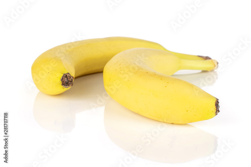 Group of two whole ripe yellow banana isolated on white background