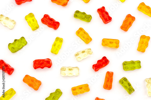 Pattern of colorful fruit gummy bears isolated on white background