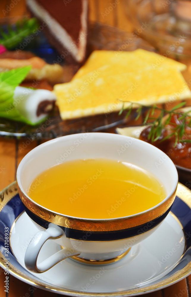 Hot fruit-tea with dessert on the table Hot fruit-tea with dessert on the table