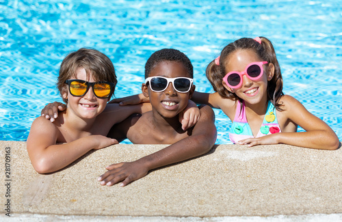 kids smiling and happy at the pool