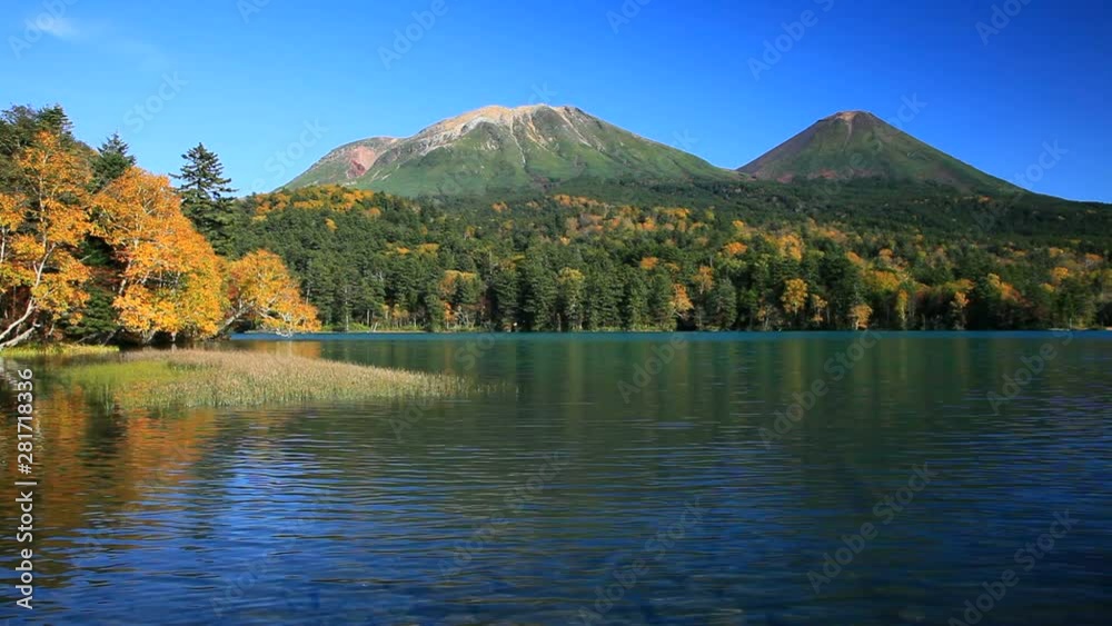 Lake Onetto and autumn forest surrounding Mount Meakan and Akan Fuji Lake Onetto and autumn forest surrounding Mount Meakan and Akan Fuji