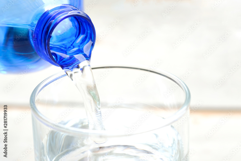 Clean water for good health. Pouring Fresh Pure Water From Pitcher Into A Glass on table wooden. Health And Diet Concept. Lifestyle Healthcare And Beauty. Clean water for good health. Pouring Fresh Pure Water From Pitcher Into A Glass on table wooden. Health And Diet Concept. Lifestyle Healthcare And Beauty.
