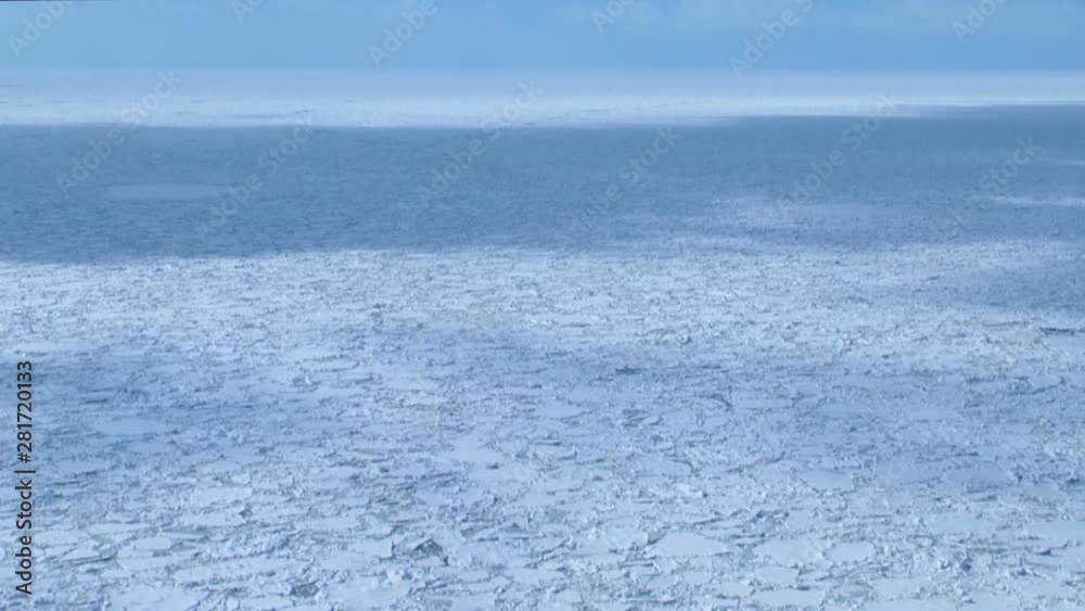 Timelapse of clouds casting shadows over ice floe Timelapse of clouds casting shadows over ice floe