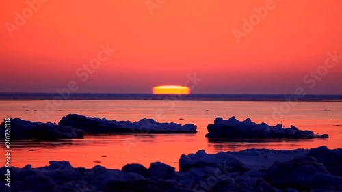 View of sunset above sea, Betsukai, Hokkaido, Japan photo