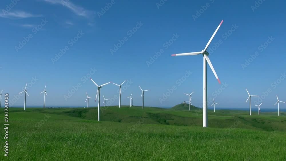 Wide shot of wind turbines on windy summer day, Wakkanai, Hokkaido Wide shot of wind turbines on windy summer day, Wakkanai, Hokkaido