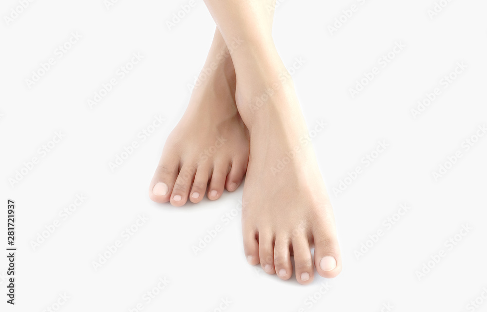 Beautiful female legs and feet on a white background. Concept beauty and hydration of the skin.