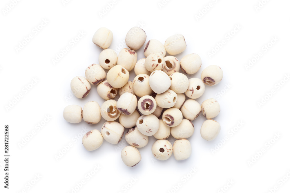 Pile of dried lotus seeds isolated on white background. Top view.