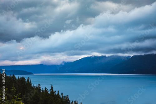 Low storm clouds over lake during sunrise © eacmich