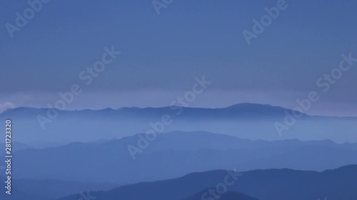 Mountains in fog at sunrise, Zao, Miyagi Prefecture, Japan photo