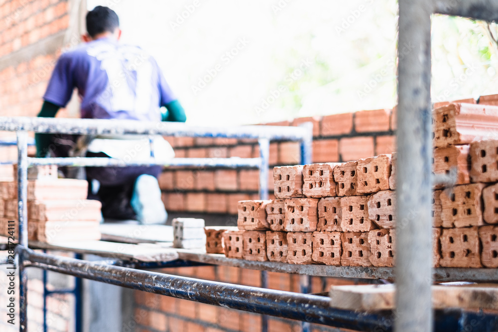 Pile of of bricks placing in row prepared for new house construction Pile of of bricks placing in row prepared for new house construction