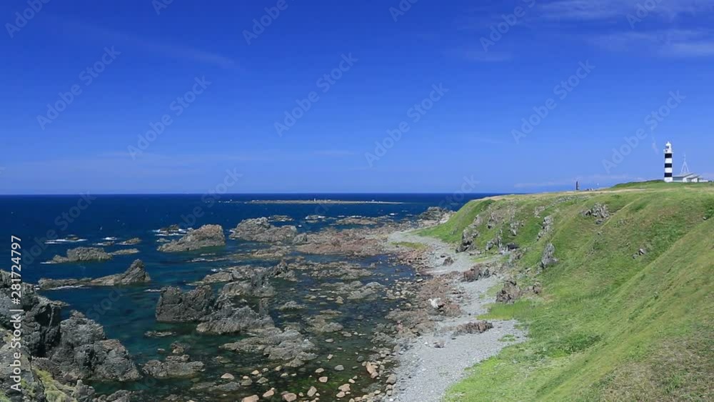 Rock formations on shore and lighthouse, Oga, Akita Prefecture, Japan Rock formations on shore and lighthouse, Oga, Akita Prefecture, Japan