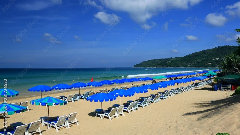 Lounge chairs and umbrellas on Karon Beach, Phuket, Thailand Lounge chairs and umbrellas on Karon Beach, Phuket, Thailand