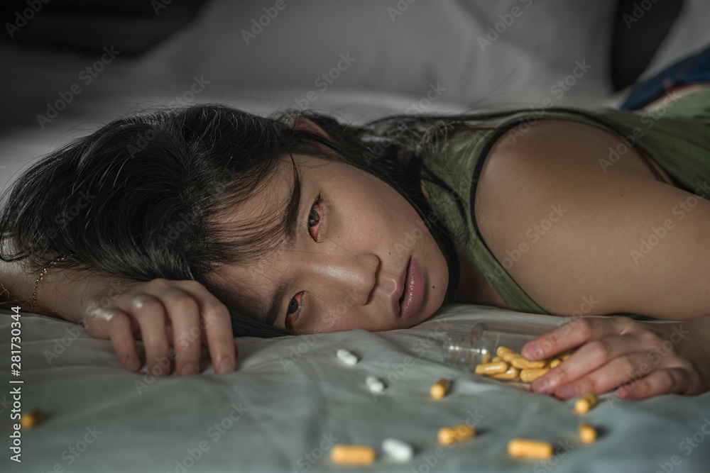 young beautiful desperate and wasted addict Asian Japanese woman taking
