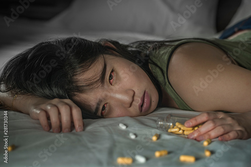 Photos young beautiful desperate and wasted addict Asian Japanese woman taking drug ove