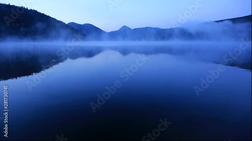 Lake Shikaribetsu and fog at sunrise, Shikaoi, Hokkaido, Japan photo