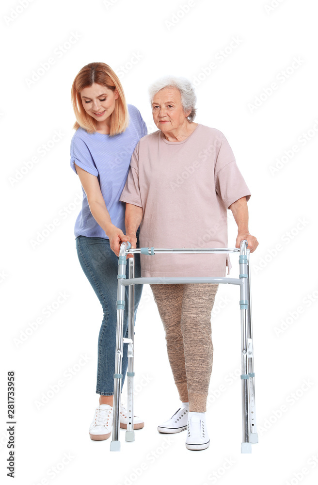 Caretaker helping elderly woman with walking frame on white background Caretaker helping elderly woman with walking frame on white background