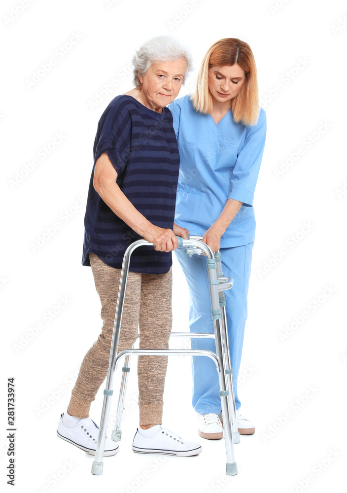 Caretaker helping elderly woman with walking frame on white background Caretaker helping elderly woman with walking frame on white background