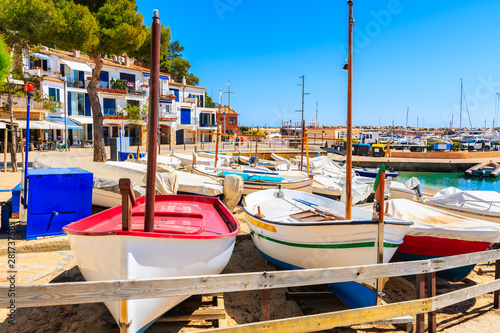 Traditional colorful fishing boats on beach in Llafranc port, Costa Brava, Spain