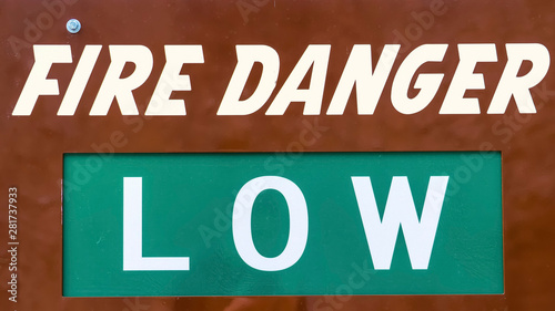 Panorama frame Close up view of a sign that reads Fire Danger Low Today