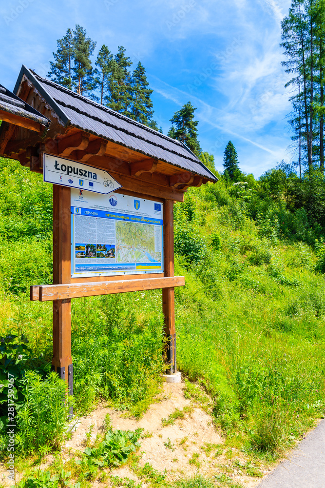 TATRA MOUNTAINS, POLAND - JUN 29, 2019: Rest stop for tourists and map with cycling ways near Dunajec river in Tatra Mountains, Poland. TATRA MOUNTAINS, POLAND - JUN 29, 2019: Rest stop for tourists and map with cycling ways near Dunajec river in Tatra Mountains, Poland.