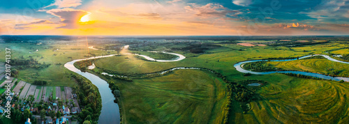 Obraz na płótnie Aerial View Green Forest Woods Meadow And River Landscape In Sunny Spring Evening