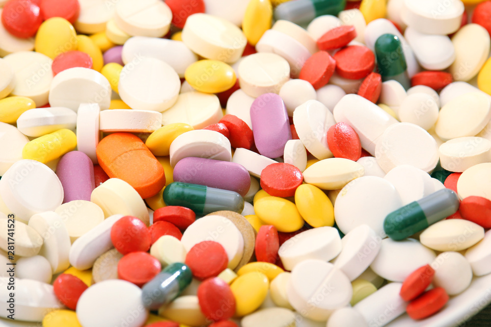 Different colorful tablets at white background Different colorful tablets at white background