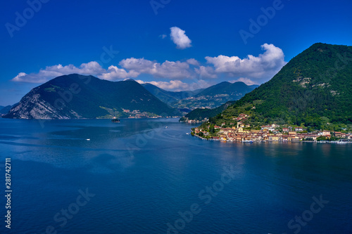 Flying over the island of Monte on Lake Iseo north of Italy. Panoramic view of the alps. A good place to rest in travel. photo