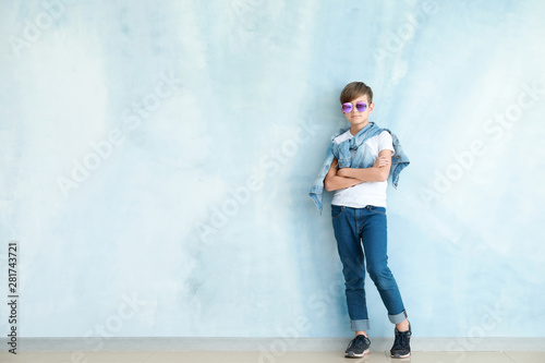 Stylish boy in jeans clothes near color wall © Pixel-Shot